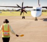 airport worker signaling directing plane airport runway 136401 2284
