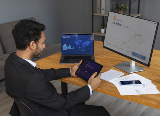 business person looking finance graphs 1