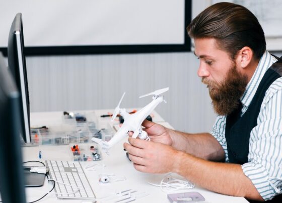 electronic toy repair shop bearded master disassembling broken hexacopter renovation business occupation technology concept 279525 1074