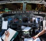 midsection pilots holding paper cockpit cityscape 1048944 20219616