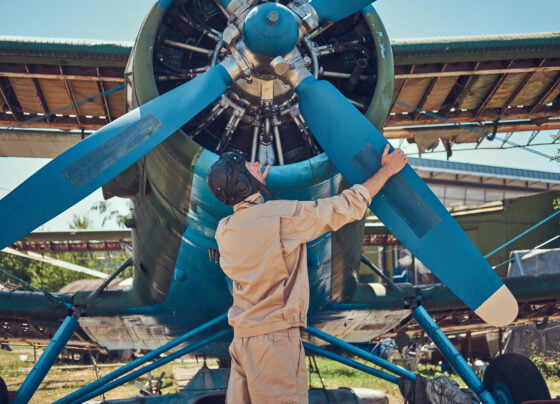 pilot mechanic full flight gear checks propeller his retro military aircraft before flight 1